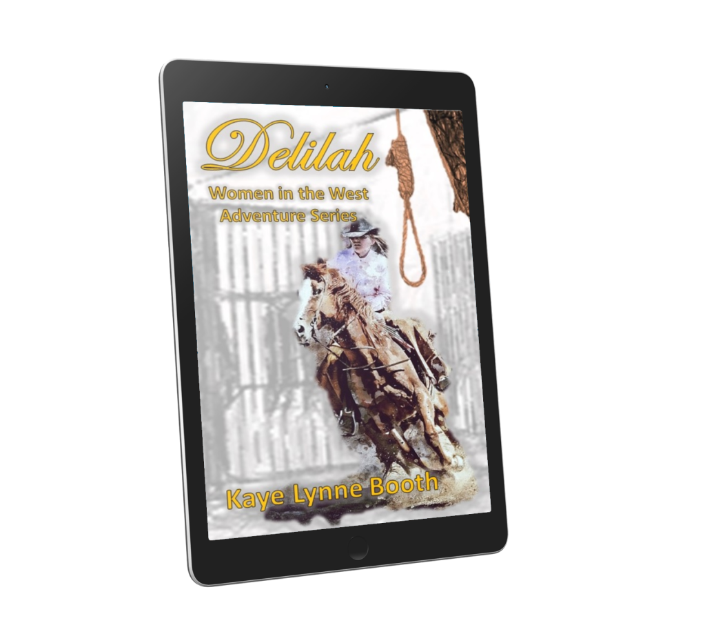 Book Cover: Delilah on a digital device. A woman on horseback racing away from prison gates with a hangman's noose hanging down from upper right side.
Text: Delilah, Women in the West Adventure Series, Kaye Lynne Booth