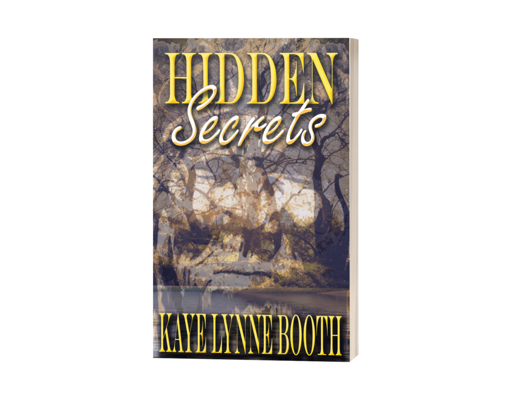 Book Cover: river and woods with American Indian face superimposed over it.
Text: Hidden Secrets, Kaye Lynne Booth